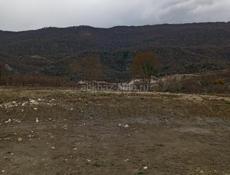 Участок с панорамным видом на горы и море .