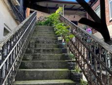 В самом центе города сдаю комнату с кухней