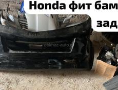Honda Fit дверь багажник, бампер, задний фонарь, фары, зеркала, лобовое стекло и много других запчастей в наличии и под заказ 