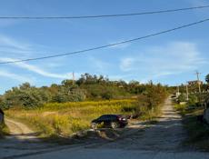 Продается участок 50 соток в Ачадаре ( 100 м от трассы )