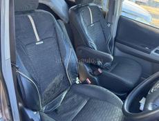 Тойота Вокси 2.0