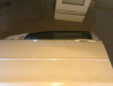 Двери на мазда демио 