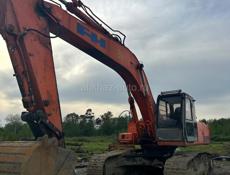 Услуги экскаватора, бульдозера и трала.