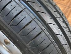 Покрышка новая с диском 