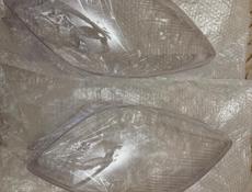 Стекло фар Toyota Vitz