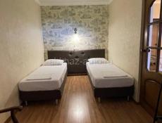 Продам две квартиры участком в центре Гагры