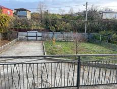 Жилой бельэтажный дом с участком 18 соток в Сухуме